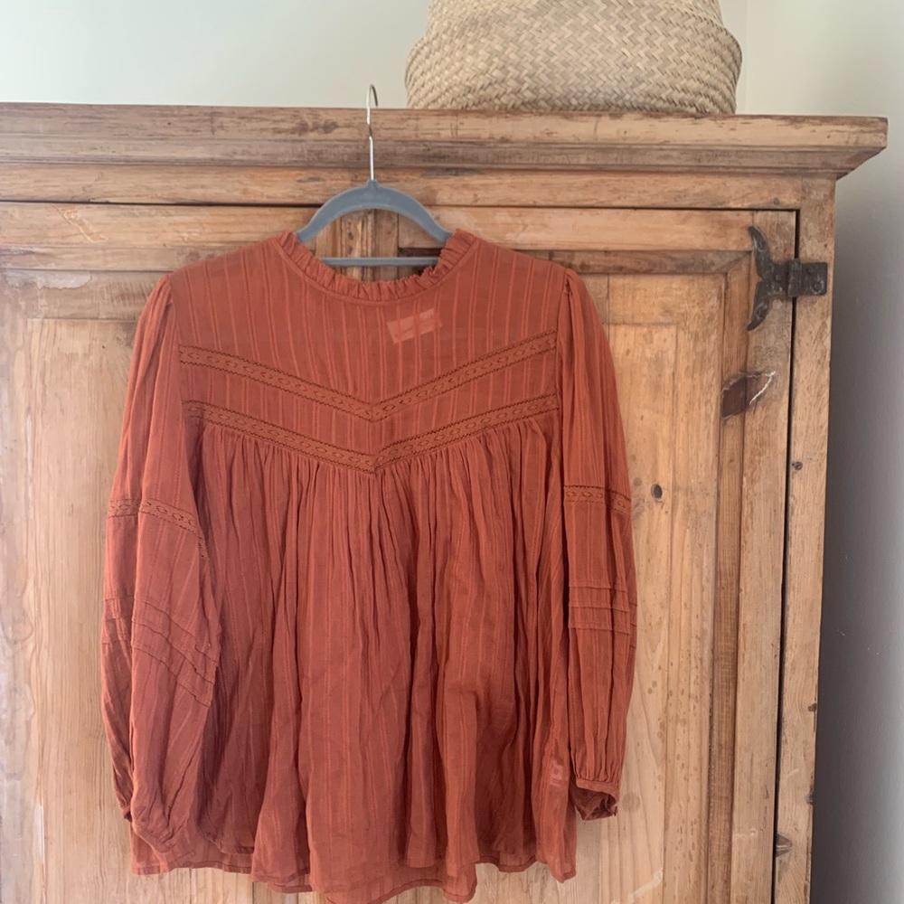 flowy muted orange/rust high neck long sleeve blouse